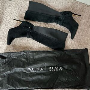 Black Suede knee length stretchy boots with side detail.